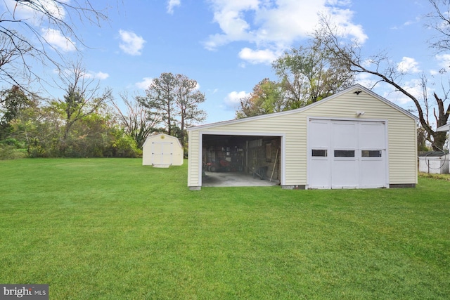 garage featuring a lawn