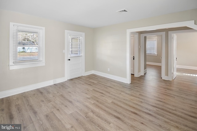 empty room with light wood-type flooring