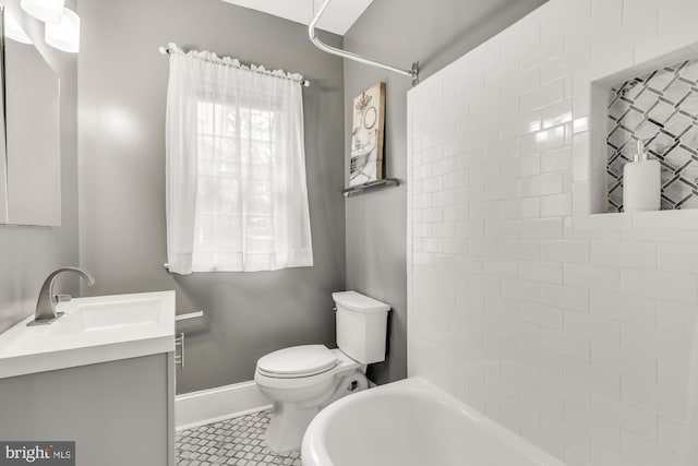 bathroom with tile patterned floors, vanity, and toilet