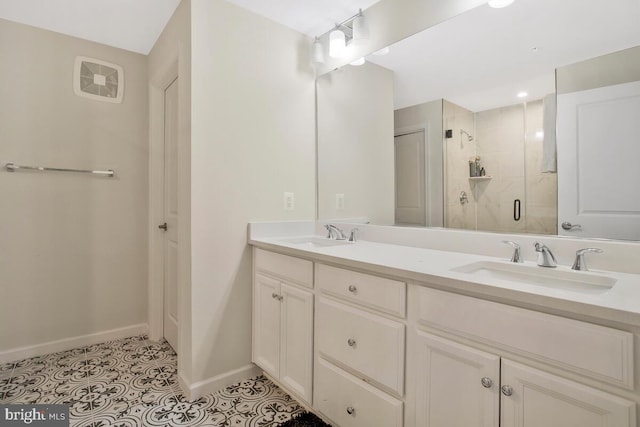 bathroom featuring vanity, tile patterned floors, and an enclosed shower