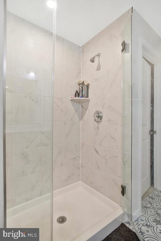 bathroom featuring an enclosed shower