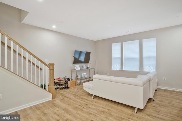 living room with light hardwood / wood-style floors