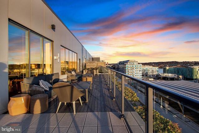 balcony at dusk with outdoor lounge area