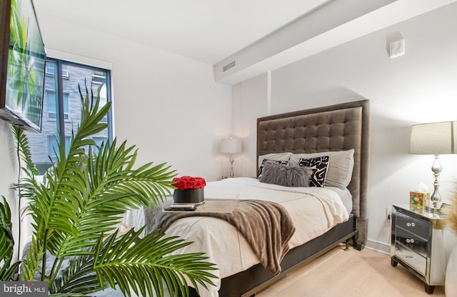 bedroom with light wood-type flooring