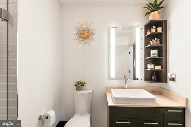 bathroom with vanity and toilet