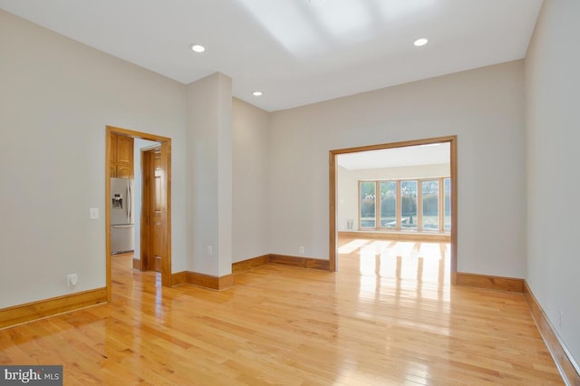 spare room featuring light hardwood / wood-style floors