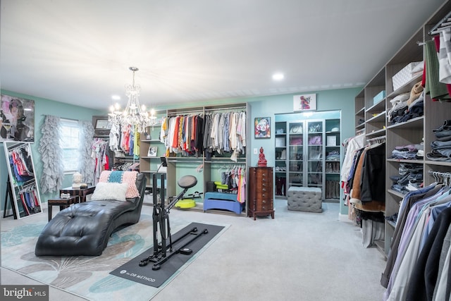 exercise room with carpet and a chandelier