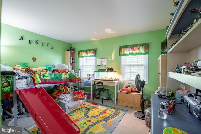 bedroom featuring light carpet