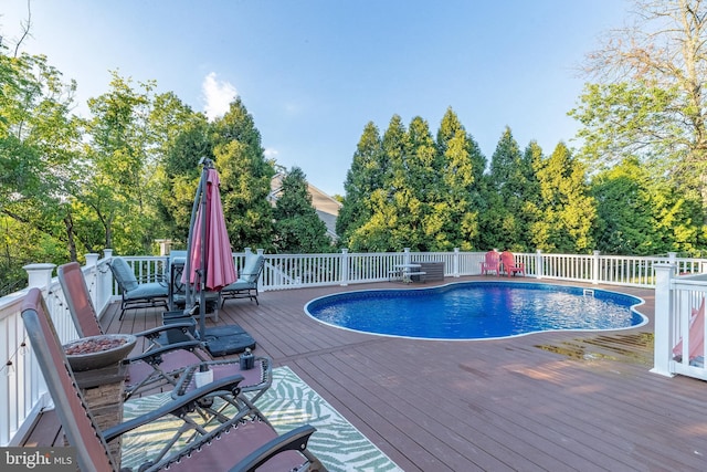 view of pool featuring a wooden deck