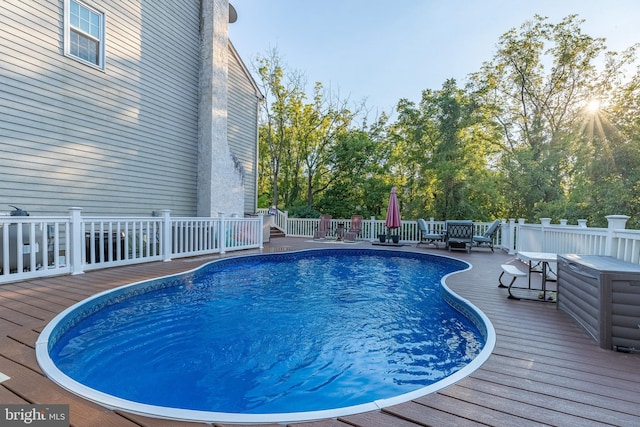 view of pool with a wooden deck