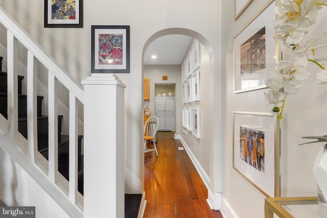 corridor featuring dark hardwood / wood-style flooring