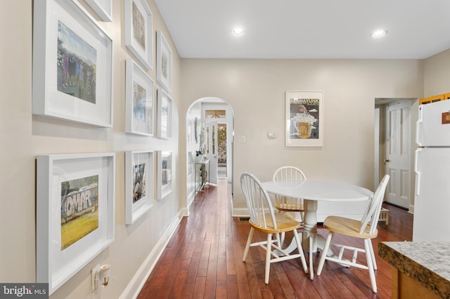 dining space featuring dark hardwood / wood-style floors