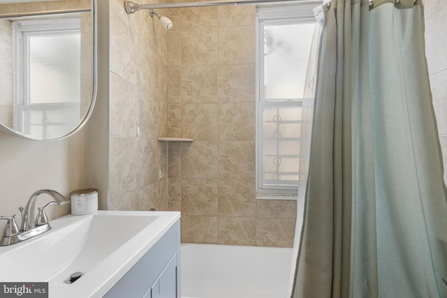 bathroom with shower / bath combination with curtain and vanity