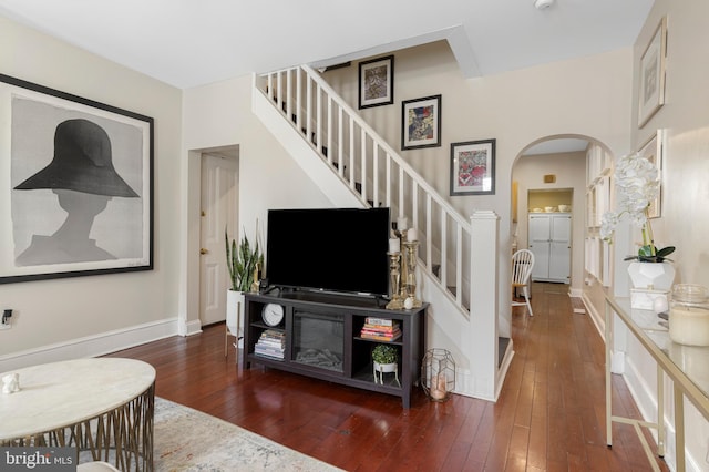 living room featuring dark wood-type flooring