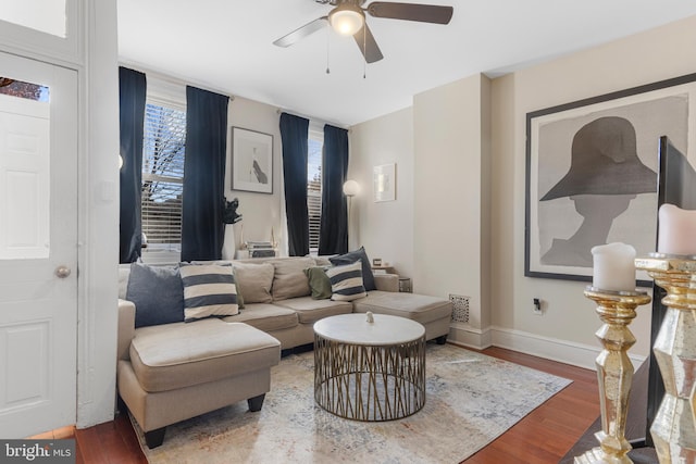 living room with ceiling fan and wood-type flooring