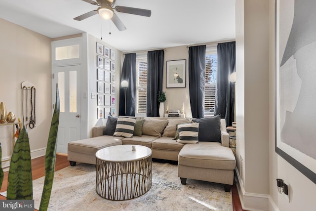 living room featuring hardwood / wood-style flooring and ceiling fan