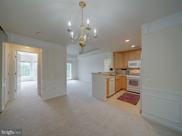 kitchen featuring kitchen peninsula, light colored carpet, a chandelier, white appliances, and light brown cabinetry