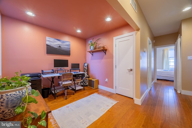 office with light hardwood / wood-style floors