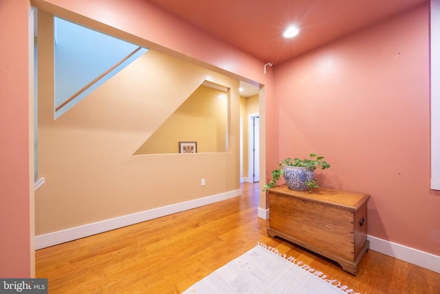 hall with wood-type flooring