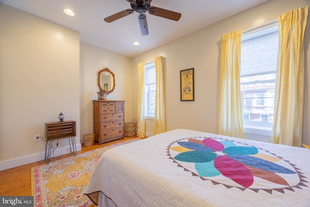 bedroom featuring ceiling fan and light hardwood / wood-style floors