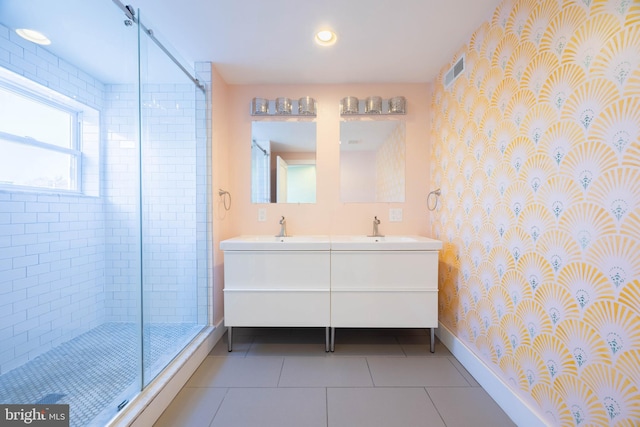 bathroom featuring tile patterned flooring, vanity, and an enclosed shower