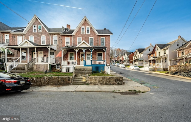 multi unit property featuring a porch