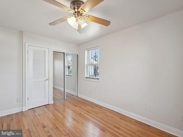 unfurnished bedroom with light hardwood / wood-style floors and ceiling fan