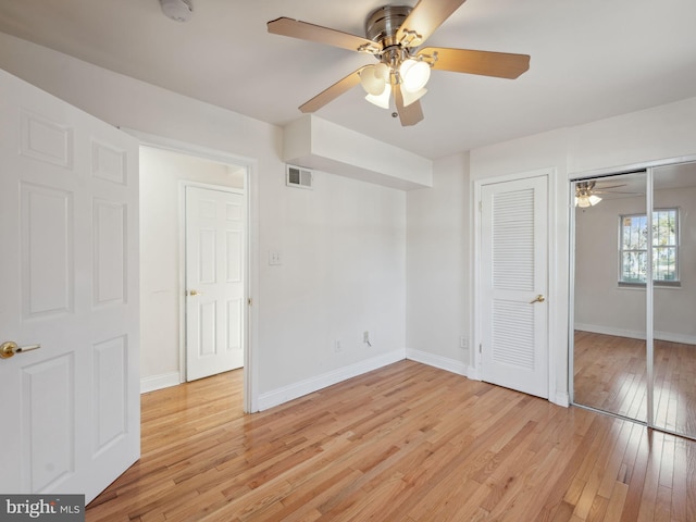 unfurnished bedroom featuring ceiling fan and light wood-type flooring