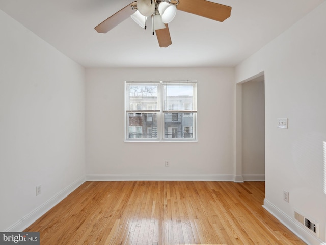 spare room featuring ceiling fan and light wood-type flooring