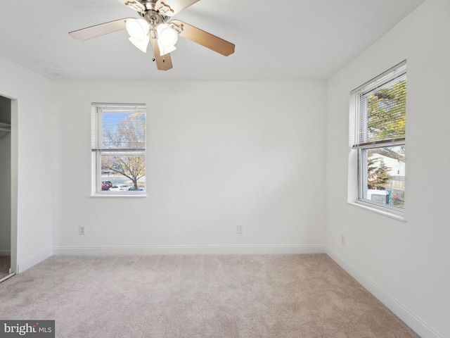 unfurnished bedroom with light carpet and ceiling fan