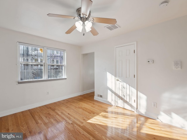 spare room with ceiling fan and light hardwood / wood-style floors