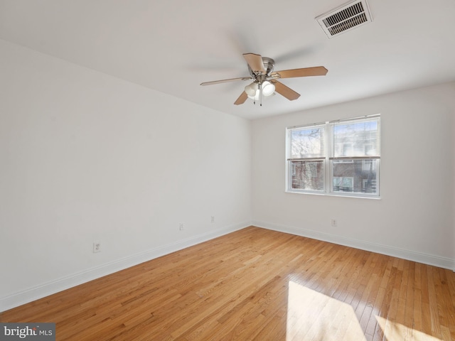 spare room featuring ceiling fan and light hardwood / wood-style floors