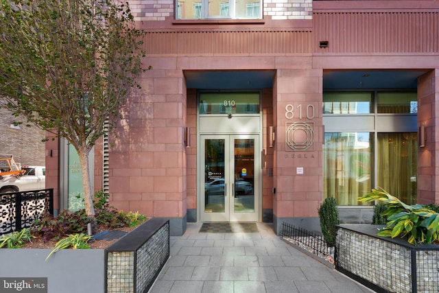 view of exterior entry featuring french doors