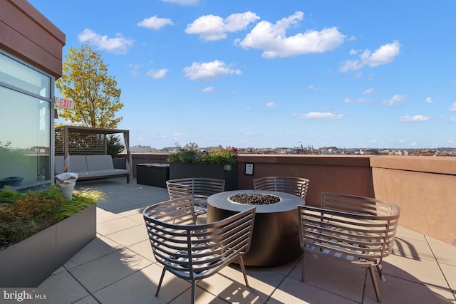 view of patio / terrace with a fire pit