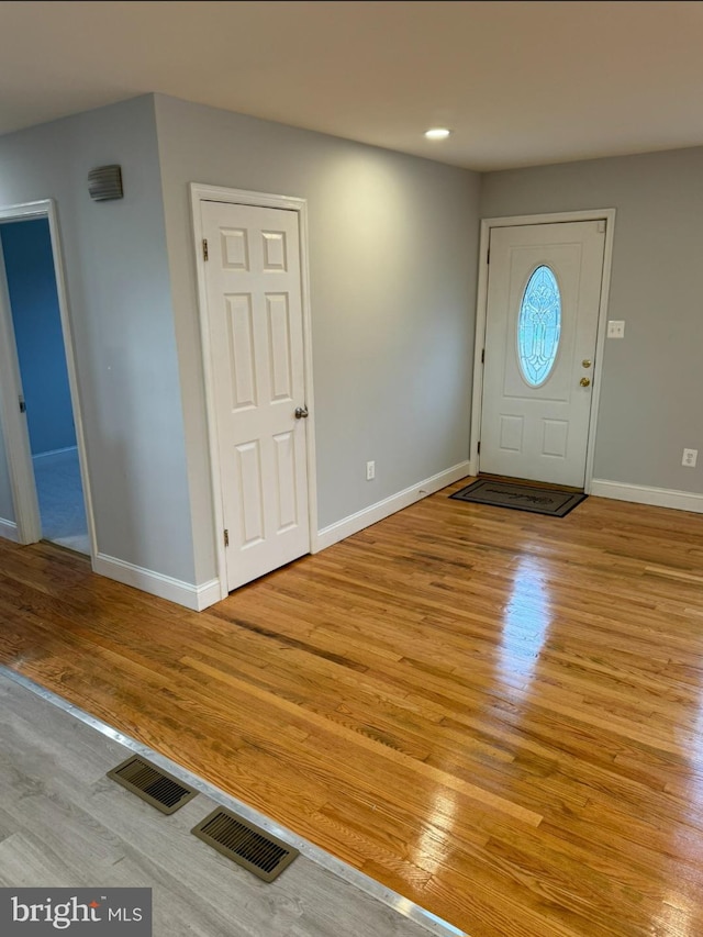 entryway with light hardwood / wood-style floors