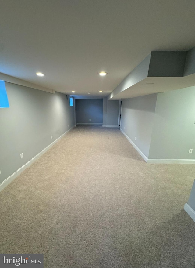 basement with light colored carpet