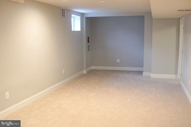 basement with light carpet