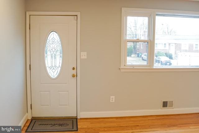 entrance foyer with light hardwood / wood-style floors