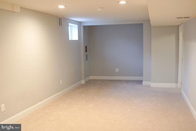 basement with light colored carpet