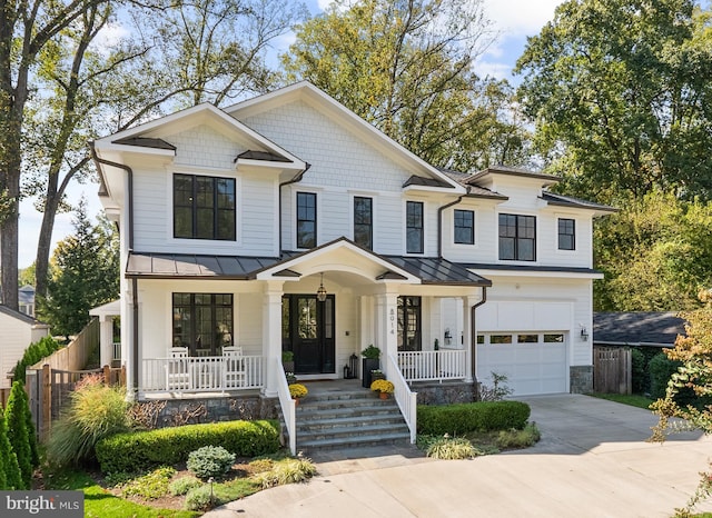 view of front of property featuring a garage and covered porch