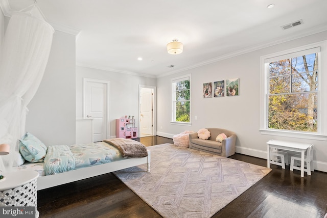 bedroom with hardwood / wood-style flooring and ornamental molding