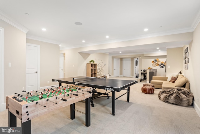 rec room featuring crown molding and light colored carpet