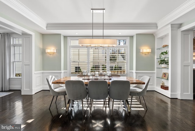 dining space featuring built in features, crown molding, and dark hardwood / wood-style floors