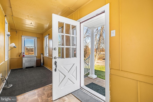 doorway to outside featuring carpet floors