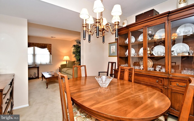 dining space with light colored carpet