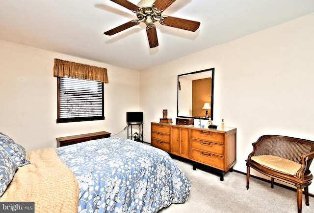 bedroom featuring ceiling fan and light colored carpet