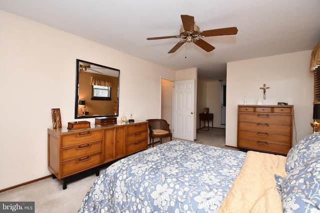 bedroom with light colored carpet and ceiling fan