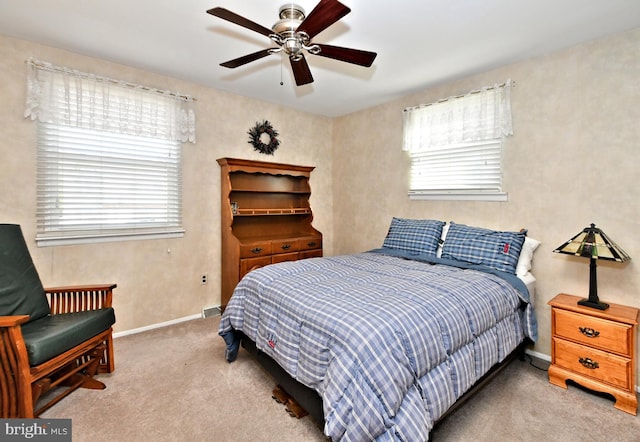 carpeted bedroom featuring ceiling fan