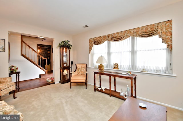 sitting room featuring light colored carpet