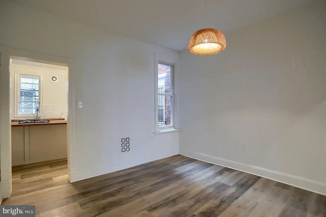 spare room featuring hardwood / wood-style floors